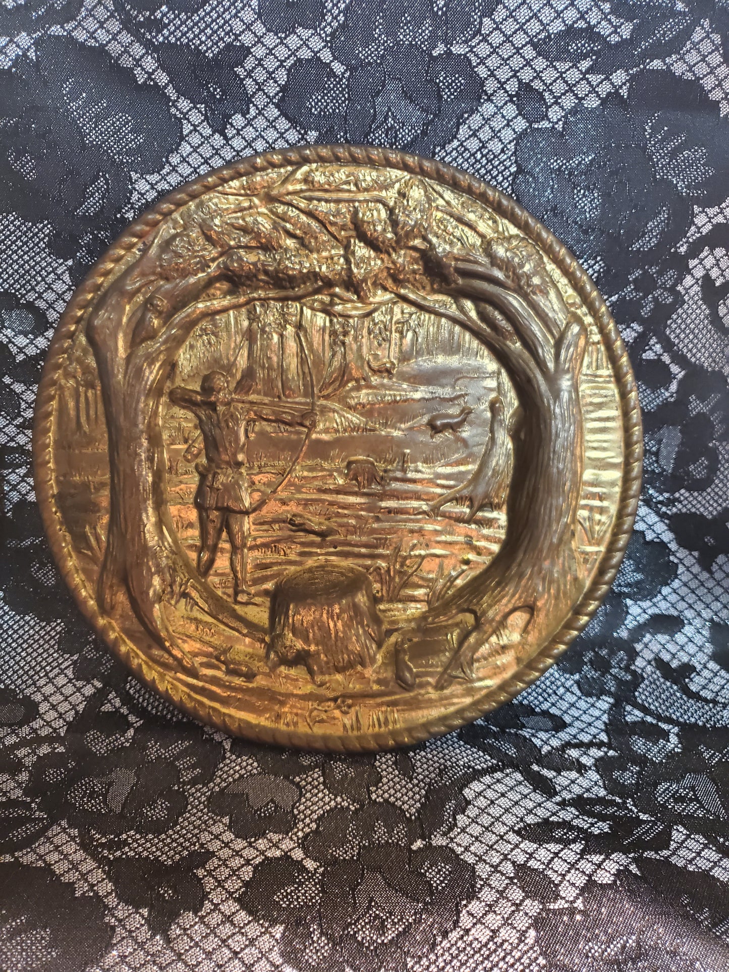 Vintage set of brass wall hanging plates.