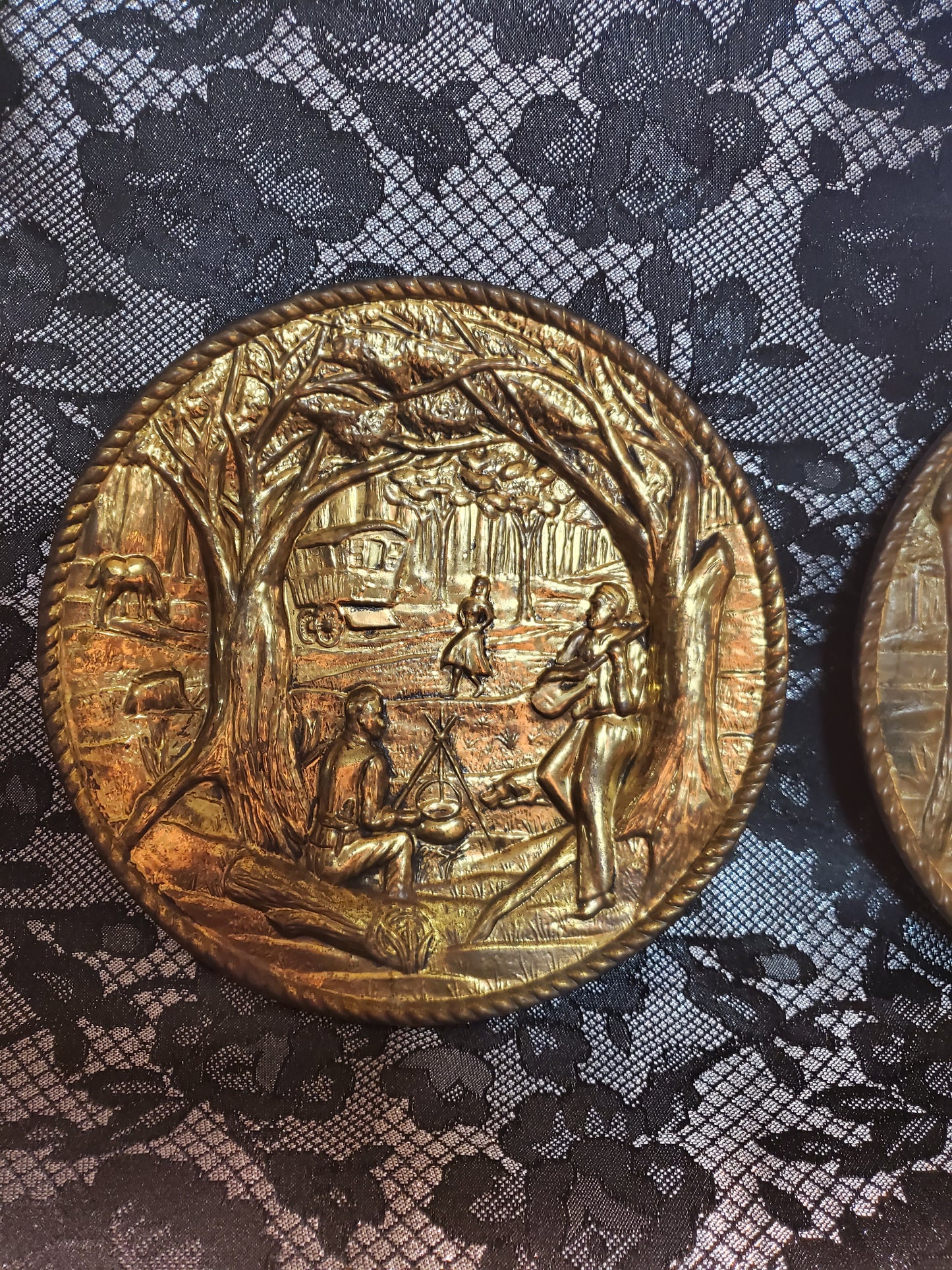 Vintage set of brass wall hanging plates.
