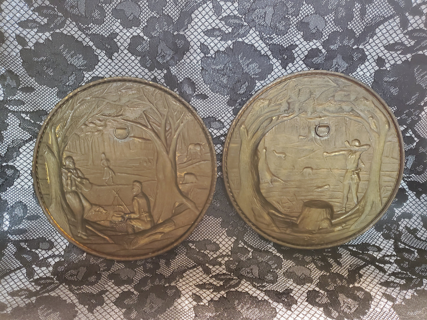 Vintage set of brass wall hanging plates.